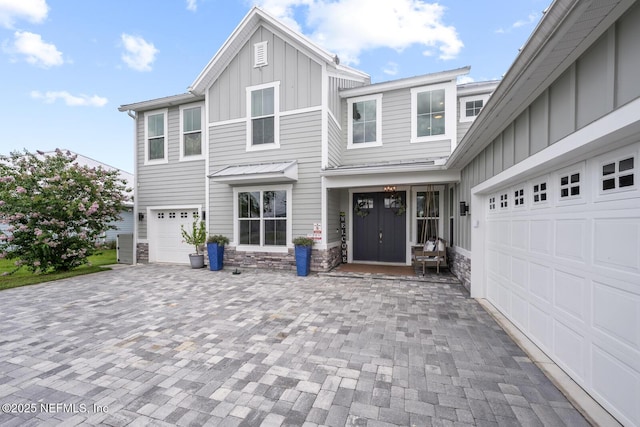 83 Tortola Way, Saint Johns, FL 32259 - view of front of property featuring board and batten siding, stone siding, and decorative driveway