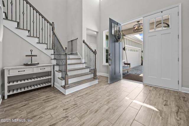83 Tortola Way, Saint Johns, FL 32259 - entrance foyer featuring stairs, wood finished floors, a chandelier, and a high ceiling