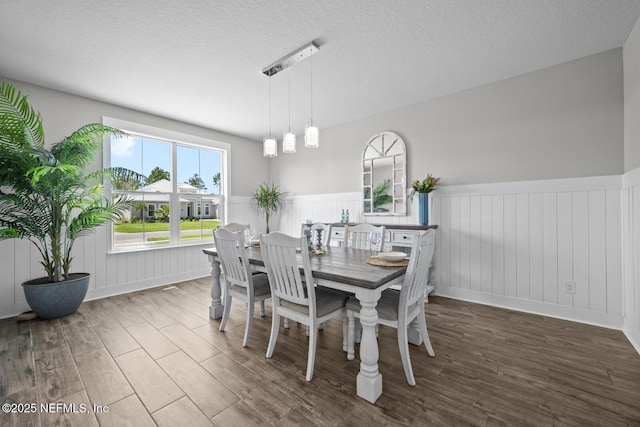 83 Tortola Way, Saint Johns, FL 32259 - dining room with wainscoting, wood finished floors, and a textured ceiling