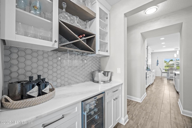 83 Tortola Way, Saint Johns, FL 32259 - bar with wine cooler, backsplash, and light wood finished floors