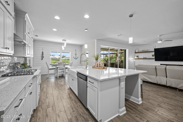 83 Tortola Way, Saint Johns, FL 32259 - kitchen with stainless steel appliances, dark wood-type flooring, recessed lighting, plenty of natural light, and white cabinetry