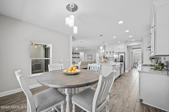 83 Tortola Way, Saint Johns, FL 32259 - dining room featuring light wood-style floors, recessed lighting, ceiling fan, and a chandelier