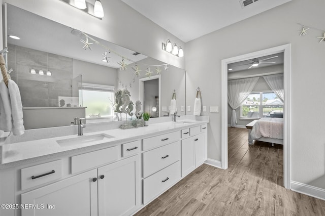 83 Tortola Way, Saint Johns, FL 32259 - ensuite bathroom with double vanity, wood finished floors, ceiling fan, and a tile shower