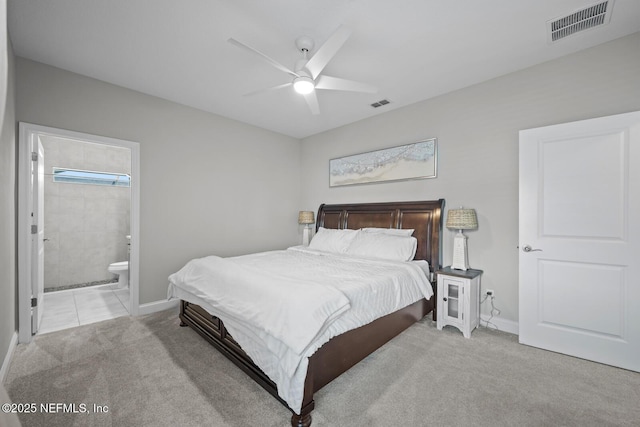 83 Tortola Way, Saint Johns, FL 32259 - bedroom with light colored carpet, ensuite bath, and a ceiling fan