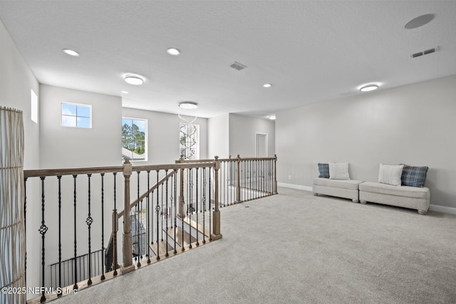 83 Tortola Way, Saint Johns, FL 32259 - hallway featuring an upstairs landing, carpet flooring, recessed lighting, and a textured ceiling