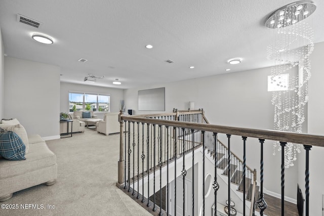 83 Tortola Way, Saint Johns, FL 32259 - corridor featuring an upstairs landing, a textured ceiling, recessed lighting, and carpet floors