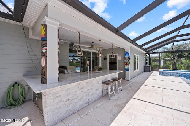 83 Tortola Way, Saint Johns, FL 32259 - view of patio / terrace with a hot tub, a lanai, ceiling fan, an outdoor kitchen, and an outdoor pool