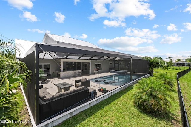 83 Tortola Way, Saint Johns, FL 32259 - back of house featuring a patio area, outdoor lounge area, a pool with connected hot tub, and a metal roof