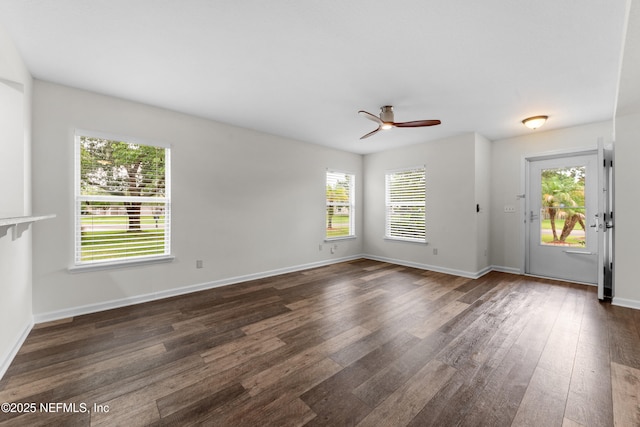1101 Chokee Pl, Saint Augustine, FL 32092 - unfurnished living room with dark wood-style floors, ceiling fan, and baseboards