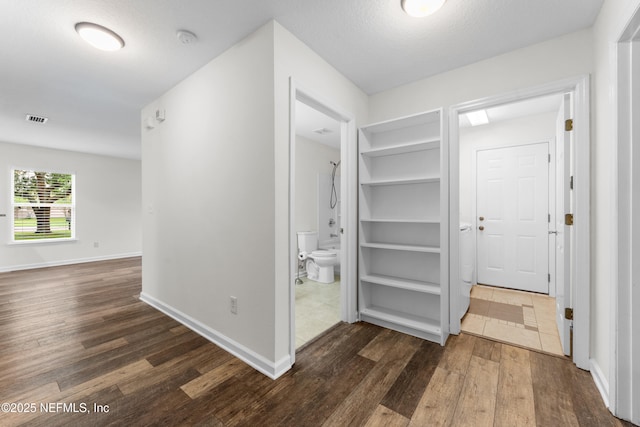 1101 Chokee Pl, Saint Augustine, FL 32092 - hallway featuring dark wood finished floors and baseboards
