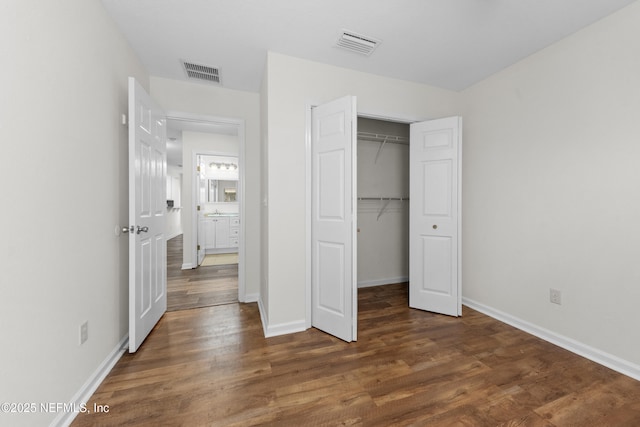 1101 Chokee Pl, Saint Augustine, FL 32092 - unfurnished bedroom featuring wood finished floors, baseboards, and a closet