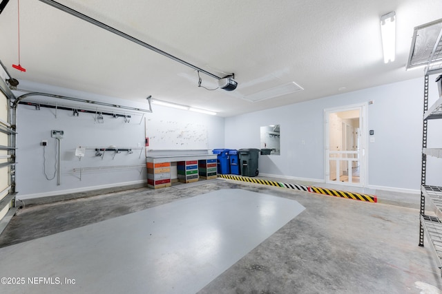 1101 Chokee Pl, Saint Augustine, FL 32092 - garage with a garage door opener and baseboards