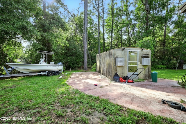 665 Grove Park Blvd, Jacksonville, FL 32216 - view of green lawn with an outbuilding and view of scattered trees