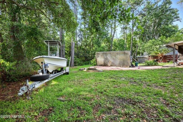 665 Grove Park Blvd, Jacksonville, FL 32216 - view of green lawn with view of wooded area