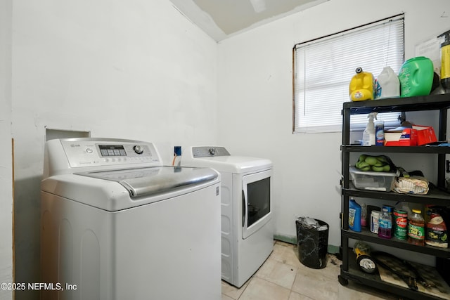 665 Grove Park Blvd, Jacksonville, FL 32216 - laundry area with washer and clothes dryer and light tile patterned floors