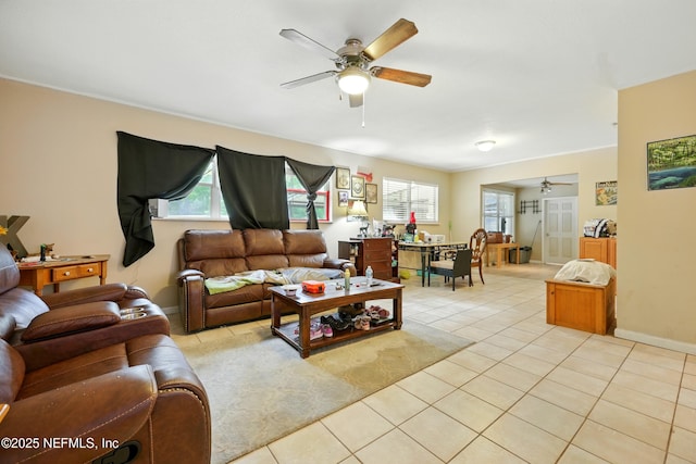 665 Grove Park Blvd, Jacksonville, FL 32216 - living area with a ceiling fan and light tile patterned floors