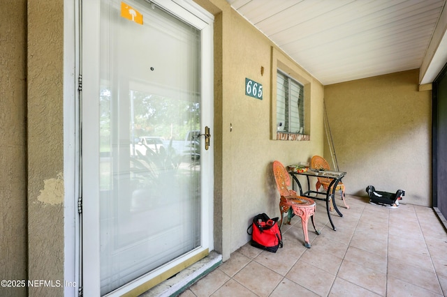 665 Grove Park Blvd, Jacksonville, FL 32216 - entrance to property with stucco siding and a balcony