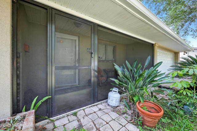665 Grove Park Blvd, Jacksonville, FL 32216 - view of exterior entry featuring a garage
