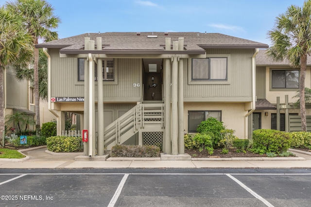 97 Village Las Palmas Cir, Saint Augustine, FL 32080 - view of property featuring stairway and uncovered parking