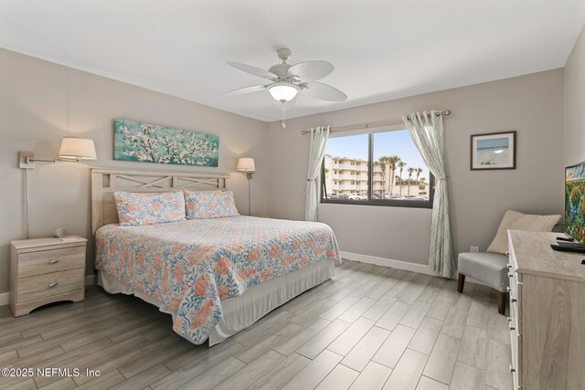 97 Village Las Palmas Cir, Saint Augustine, FL 32080 - bedroom with baseboards, light wood-style floors, and a ceiling fan