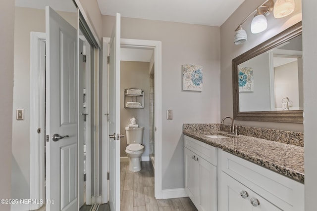 97 Village Las Palmas Cir, Saint Augustine, FL 32080 - bathroom featuring vanity, baseboards, toilet, and a shower