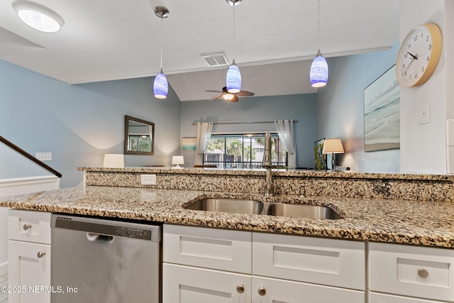 97 Village Las Palmas Cir, Saint Augustine, FL 32080 - kitchen featuring dishwasher, a sink, a ceiling fan, white cabinets, and light stone countertops