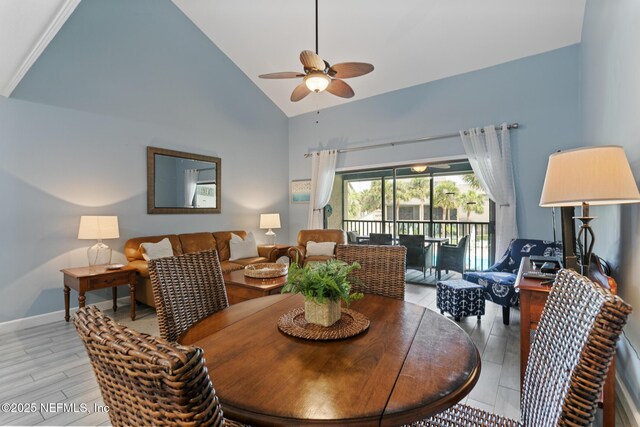 97 Village Las Palmas Cir, Saint Augustine, FL 32080 - dining room featuring a ceiling fan, high vaulted ceiling, and light wood-style flooring