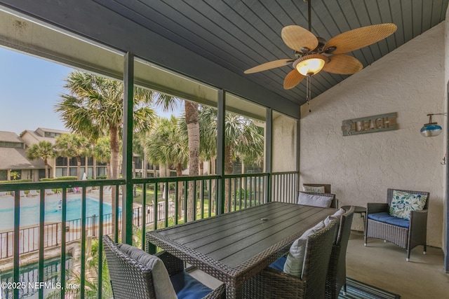 97 Village Las Palmas Cir, Saint Augustine, FL 32080 - sunroom with ceiling fan, vaulted ceiling, and outdoor dining area
