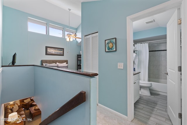 97 Village Las Palmas Cir, Saint Augustine, FL 32080 - hall with an upstairs landing, baseboards, and lofted ceiling