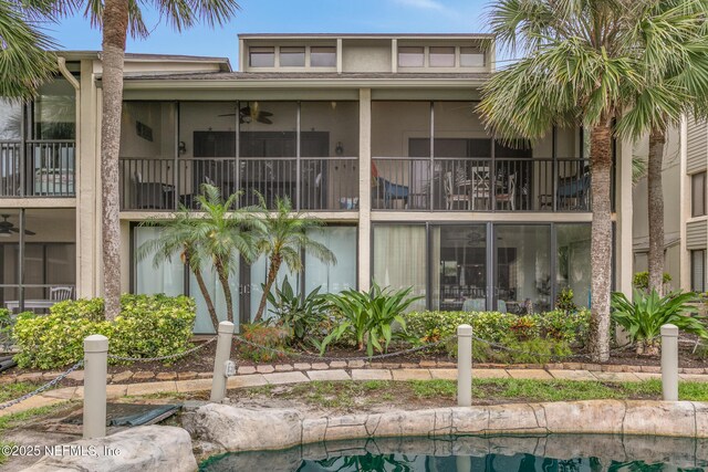 97 Village Las Palmas Cir, Saint Augustine, FL 32080 - view of pool with ceiling fan and a sunroom