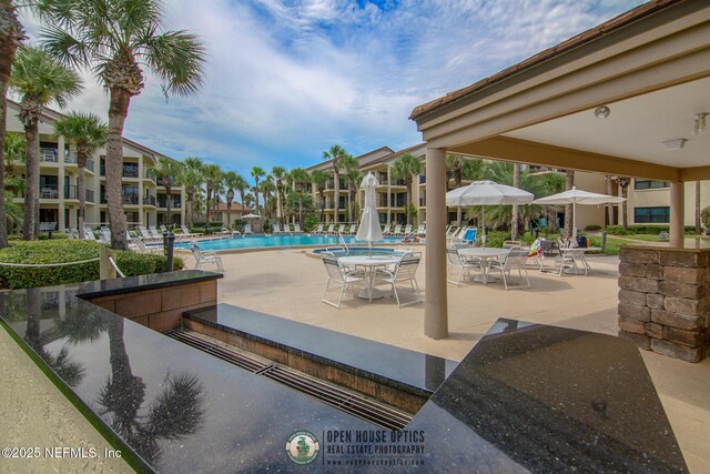 97 Village Las Palmas Cir, Saint Augustine, FL 32080 - community pool with a patio