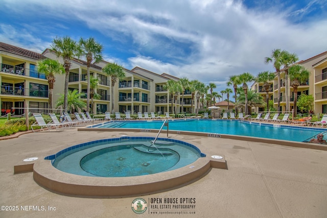 97 Village Las Palmas Cir, Saint Augustine, FL 32080 - community pool with a patio area and a community hot tub