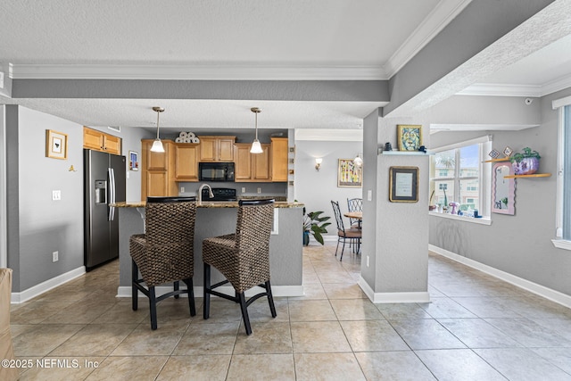 108 Laguna Villas Blvd Unit D22, Jacksonville Beach, FL 32250 - kitchen with stainless steel refrigerator with ice dispenser, black microwave, crown molding, a textured ceiling, and a breakfast bar