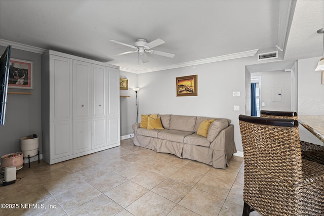 108 Laguna Villas Blvd Unit D22, Jacksonville Beach, FL 32250 - living area featuring ceiling fan, crown molding, light tile patterned floors, and baseboards