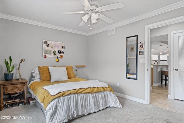 108 Laguna Villas Blvd Unit D22, Jacksonville Beach, FL 32250 - carpeted bedroom featuring crown molding, baseboards, ceiling fan, and tile patterned floors