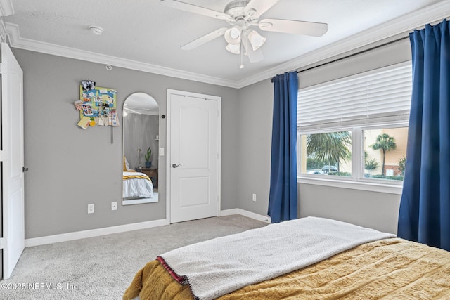 108 Laguna Villas Blvd Unit D22, Jacksonville Beach, FL 32250 - carpeted bedroom with ornamental molding, arched walkways, a ceiling fan, and baseboards