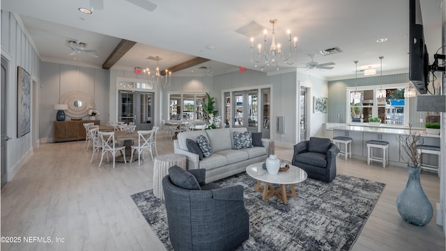 85 Otsego Ln, Saint Johns, FL 32092 - living area featuring ceiling fan, a chandelier, light wood-type flooring, plenty of natural light, and beamed ceiling