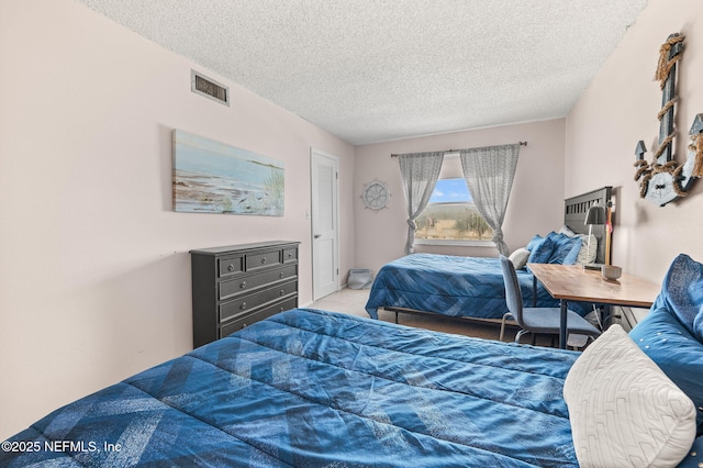 7265 A1A S Unit D11, Saint Augustine, FL 32080 - carpeted bedroom featuring a textured ceiling