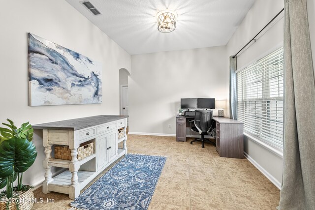 81014 Lockhaven Dr, Yulee, FL 32097 - home office with arched walkways and baseboards