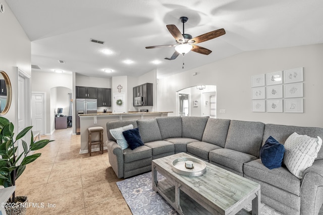 81014 Lockhaven Dr, Yulee, FL 32097 - living room with arched walkways, lofted ceiling, ceiling fan, and light tile patterned flooring