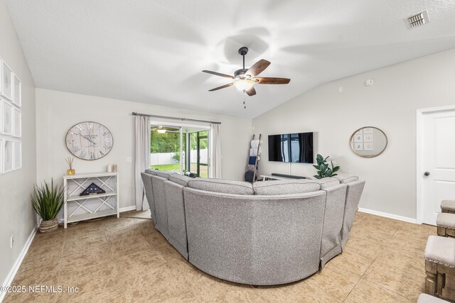 81014 Lockhaven Dr, Yulee, FL 32097 - living room featuring a ceiling fan, vaulted ceiling, baseboards, and light tile patterned floors