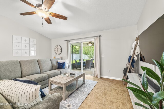 81014 Lockhaven Dr, Yulee, FL 32097 - living room with lofted ceiling, a ceiling fan, light tile patterned floors, and baseboards