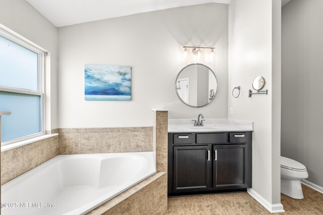 81014 Lockhaven Dr, Yulee, FL 32097 - bathroom featuring vanity, a bath, and toilet