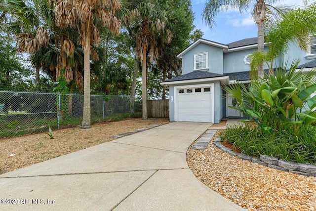 66 W 14th St, Atlantic Beach, FL 32233 - view of yard with concrete driveway and an attached garage