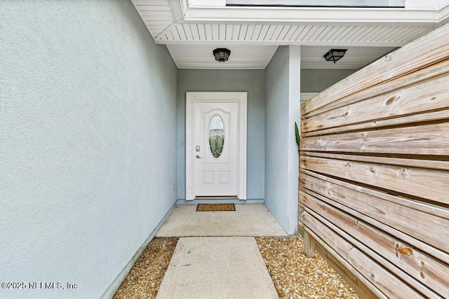 66 W 14th St, Atlantic Beach, FL 32233 - doorway to property featuring stucco siding