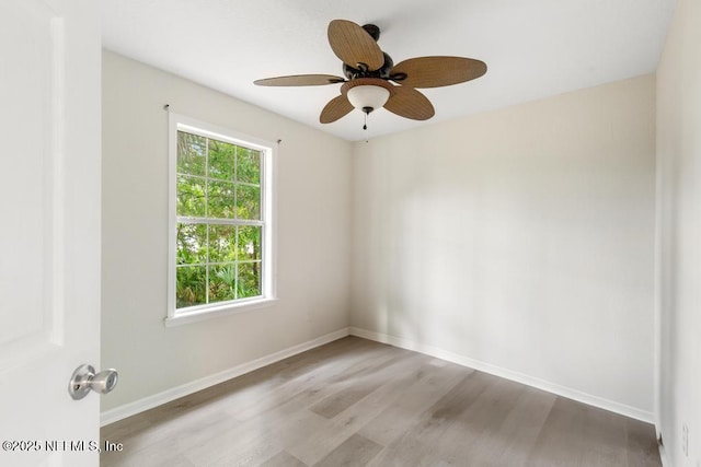 66 W 14th St, Atlantic Beach, FL 32233 - empty room with wood finished floors, baseboards, and ceiling fan