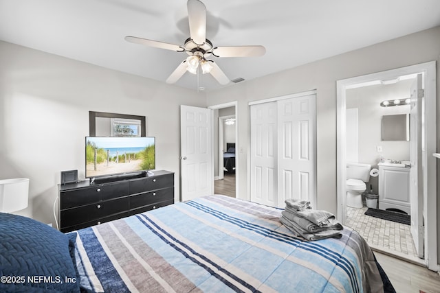 10836 Hawaii Dr S, Jacksonville, FL 32246 - bedroom with wood finished floors, a closet, ceiling fan, and connected bathroom