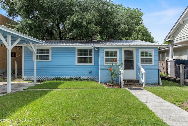 82 Kings Ferry Way, Saint Augustine, FL 32084 - view of front of house with a front lawn, metal roof, and entry steps