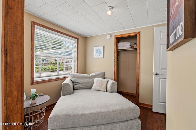 82 Kings Ferry Way, Saint Augustine, FL 32084 - sitting room featuring dark wood-style floors and baseboards
