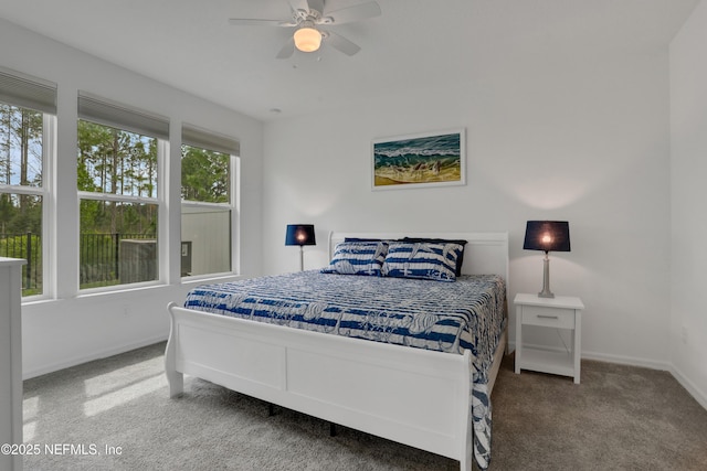 564 Jubilee Cir, Yulee, FL 32097 - carpeted bedroom with baseboards and ceiling fan